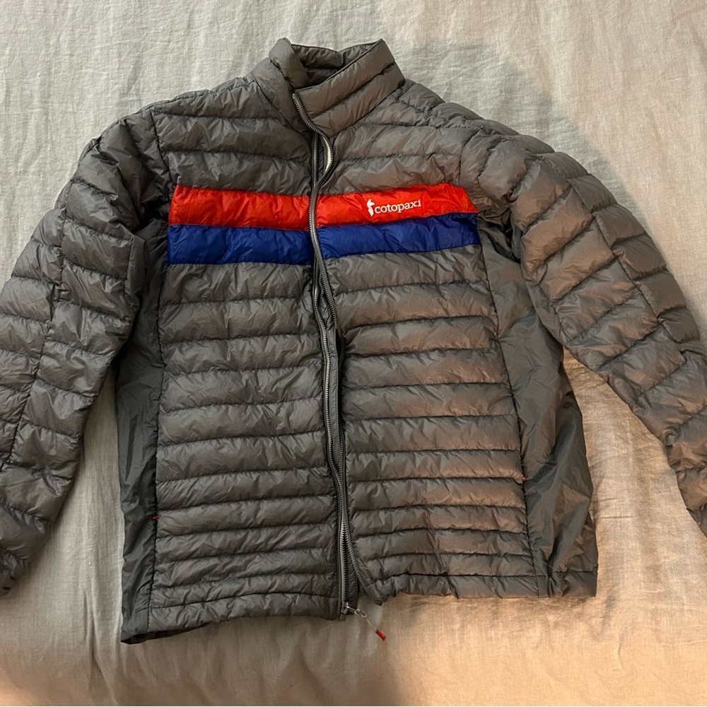 Cotopaxi Men's Puffer Jacket in Gray with Red and Blue Stripes